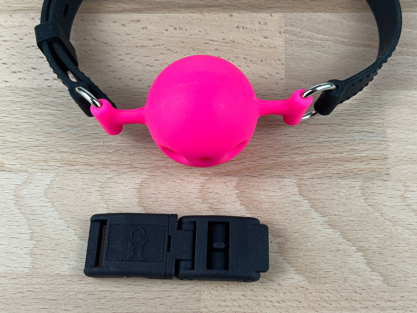 Silikon Ballknebel mit Kink-Lock Schnellverschluss, neon pink, schwarz